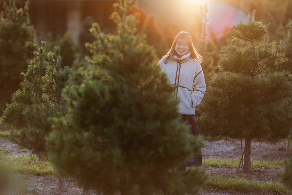 Picture taken during Christmas tree farm session near Houston Texas, during golden hour.